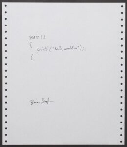 a handwritten program listing in c that prints "hello, world!" by Brian Kernighan from 1978